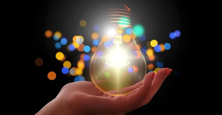 Lightbulb held in a hand